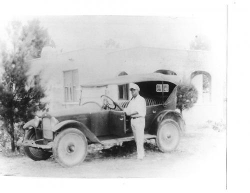 Horace Sharpe in front of one of the first homes in Liberty City. The Sharpe family was one of the first black families in Lemon City.