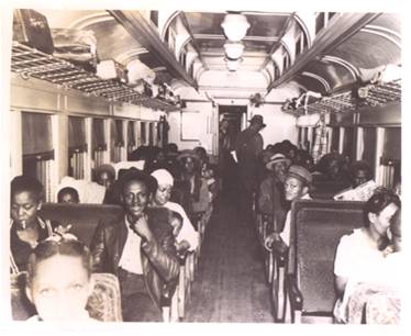 Civil Rights- A segregated train coach for blacks leaving Miami