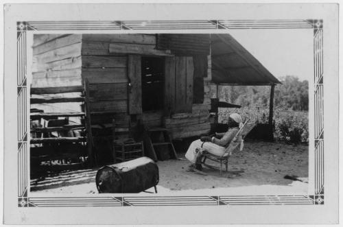 Former slave Old Aunt Julia Ann  102_ and the corn crib in which she lives.