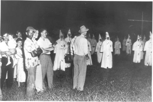KKK - A black man at a Ku Klux Klan rally _ probably an employee of one of the whites there. Florida State Archives