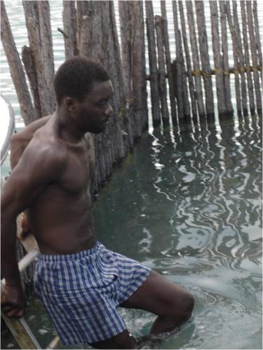Red Bays A sponge fisherman enters a man-made pen in the bay to clean sponges.