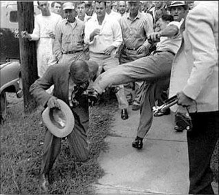 Whites attack black reporter during the fight over the desegregation of Little Rock's Central High School.